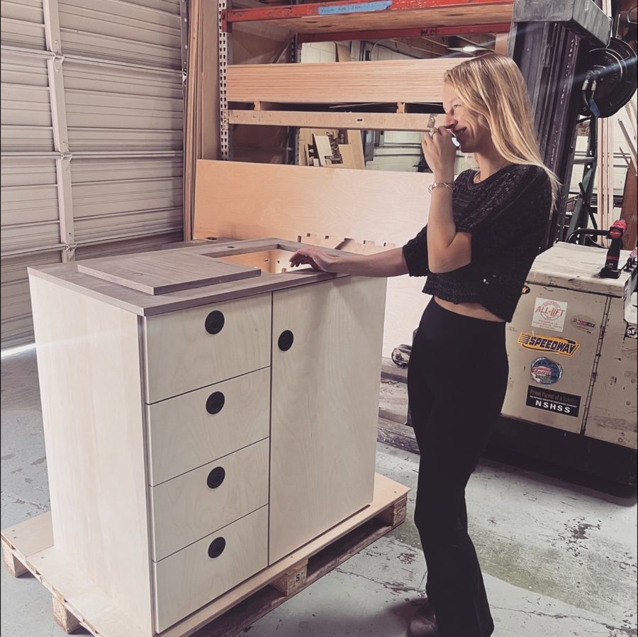 A finished birch galley cabinet on a pallet in the Veritas shop